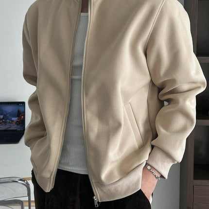 Denim jacket layered over a hoodie