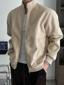 Denim jacket layered over a hoodie